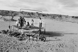 Top, in the village of Kykotsmovi, kids celebrate the 2nd birthday of Jaycee Hongeva by jumping on a trampoline. © Tomas Muscionico