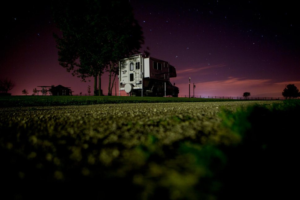In this June 13, 2015 photo, lights from the oil fields light up the sky over the Little Missouri River State Park. © Kristina Barker